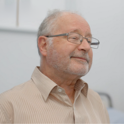 A photo of Ron smiling